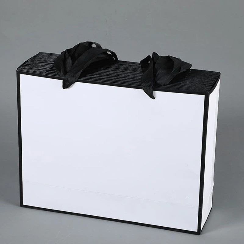 white paper bag with ribbon